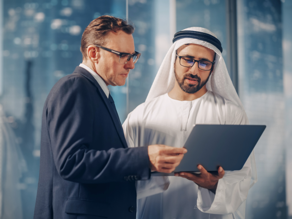 European entrepreneur discussing Dubai business setup and Golden Visa with expert consultant in modern Dubai office - EL Business Consultants 2026