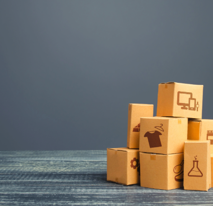 Successful trading company operations in Dubai with product packaging and shipment boxes representing thriving import export and trading businesses setup by EL Business Consultants UAE 2026